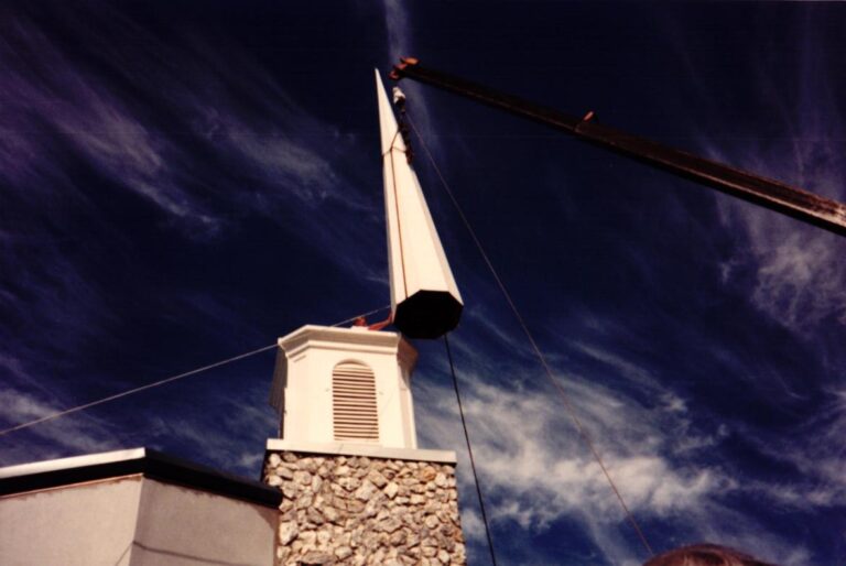 Steeple being set by crane